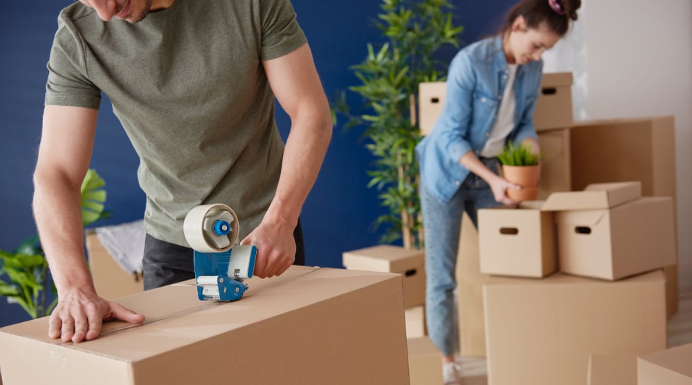 Moving day preparation with packed boxes and supplies, TrekMovers